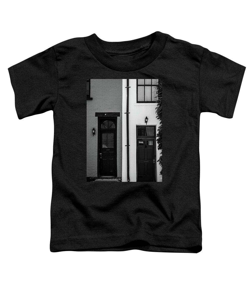 Black And White Toddler T-Shirt featuring the photograph A Pair of NYC Doors in Black and White by Liz Albro