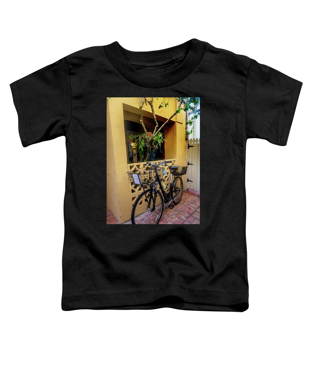 Bicycle Toddler T-Shirt featuring the photograph Bicycle in the Courtyard by Debra and Dave Vanderlaan