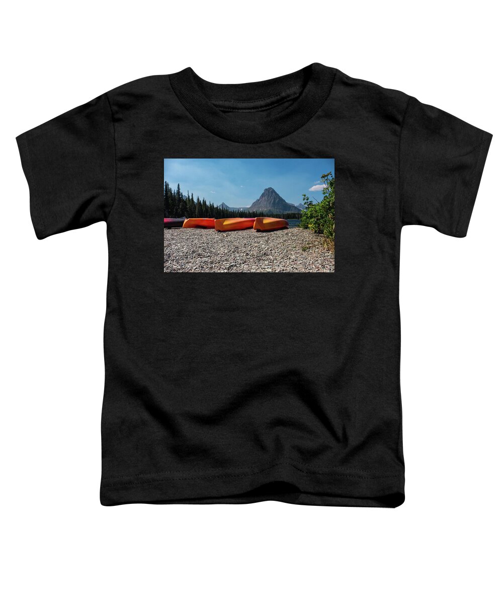 Montana Toddler T-Shirt featuring the photograph Canoe on two medicine lake by Alberto Zanoni