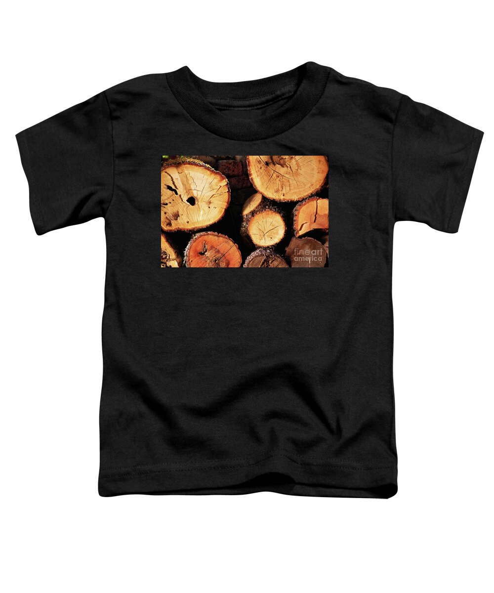 Log Toddler T-Shirt featuring the photograph Freshly cut and stacked tree logs by Mendelex Photography