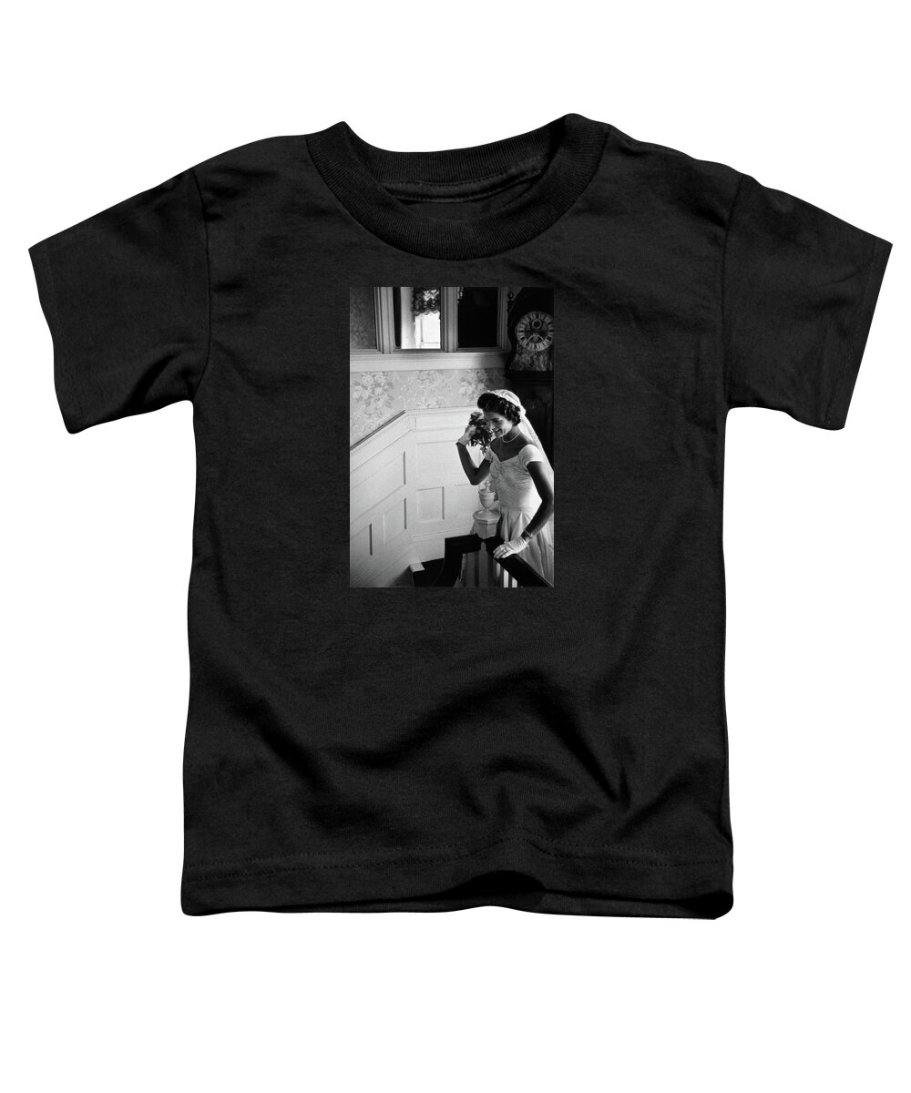 Jackie Kennedy Toddler T-Shirt featuring the photograph Jackie Kennedy Throwing Wedding Bouquet - 1953 by War Is Hell Store