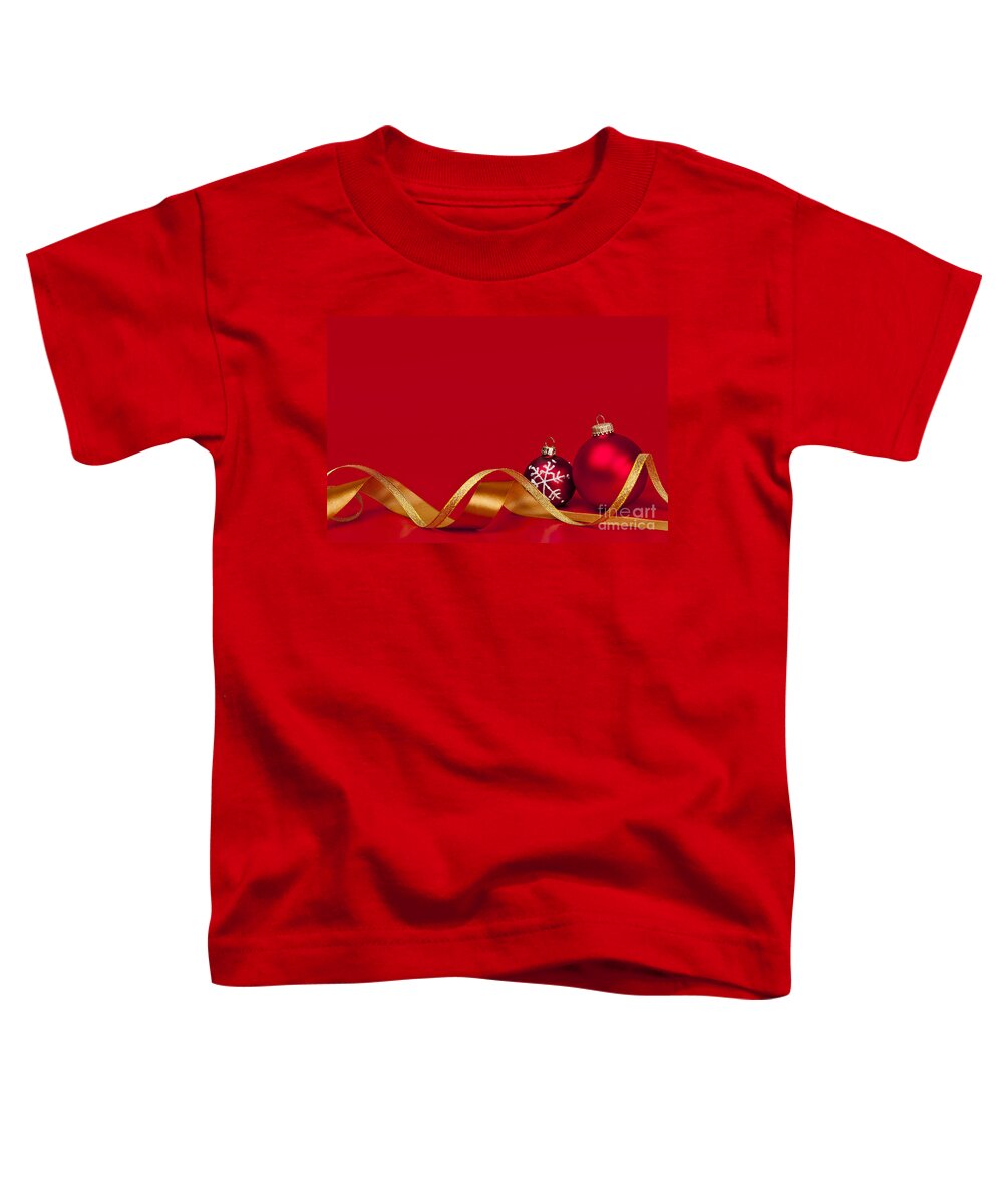 Christmas Toddler T-Shirt featuring the photograph Gold and red Christmas decorations by Elena Elisseeva