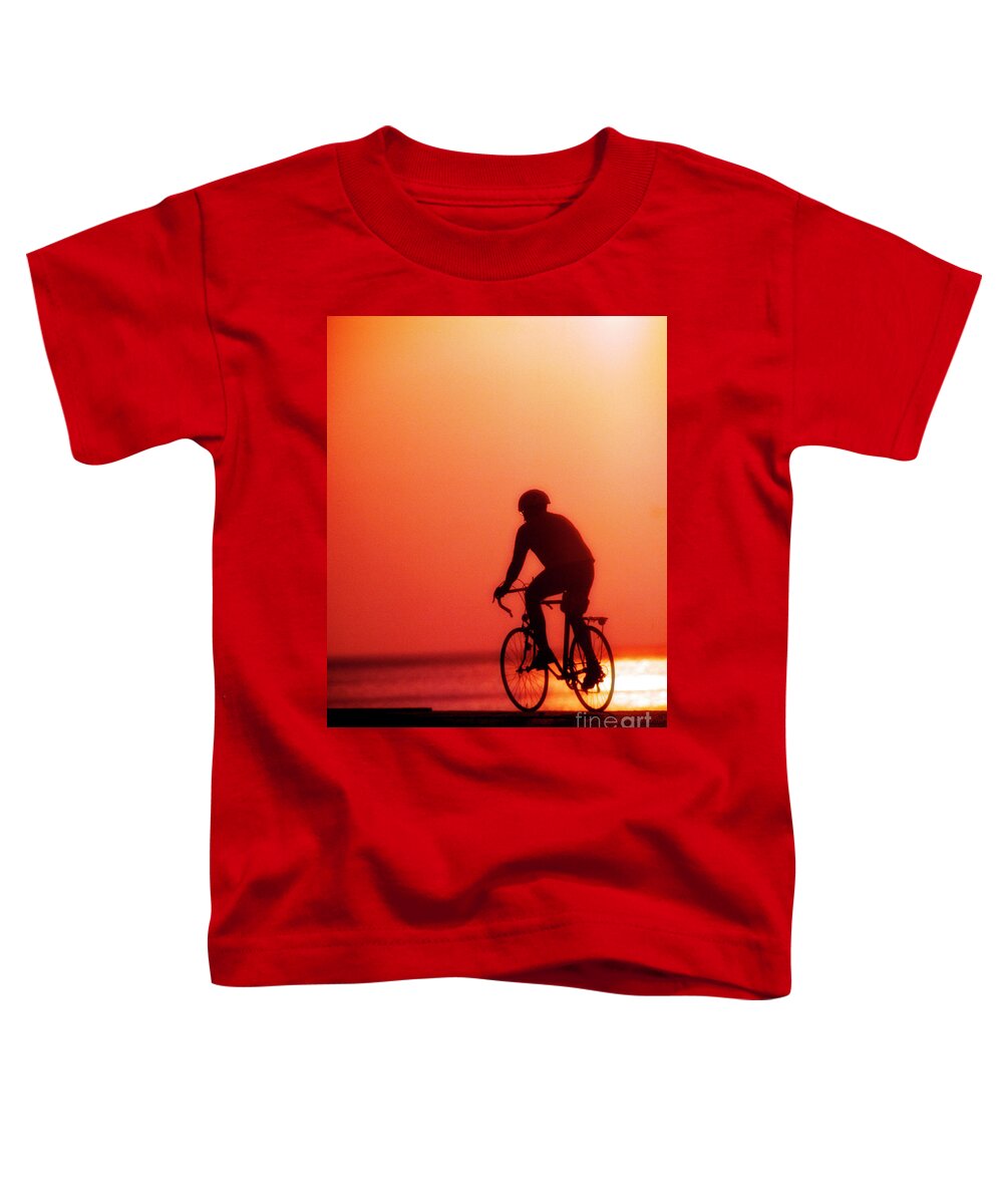 Silhouetted Toddler T-Shirt featuring the photograph Silhouetted Bike Rider Sunrise Chicago Lake Front by Tom Jelen