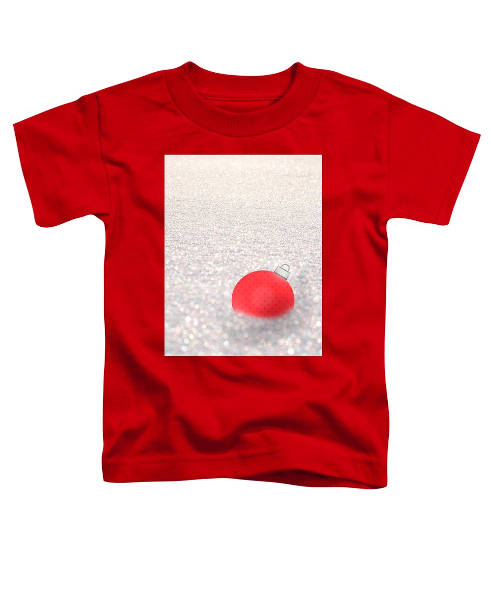Red Ball Toddler T-Shirt featuring the mixed media Red Ball in Snow by Moira Law