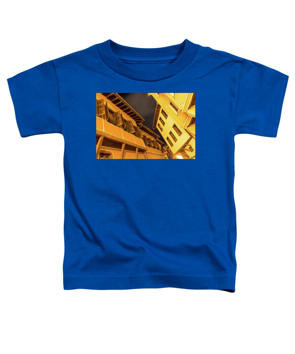 Georgia Mizuleva Toddler T-Shirt featuring the photograph Golden Yellow Night - Chic Zigzags of Oriel Windows and Serrated Roof Lines by Georgia Mizuleva