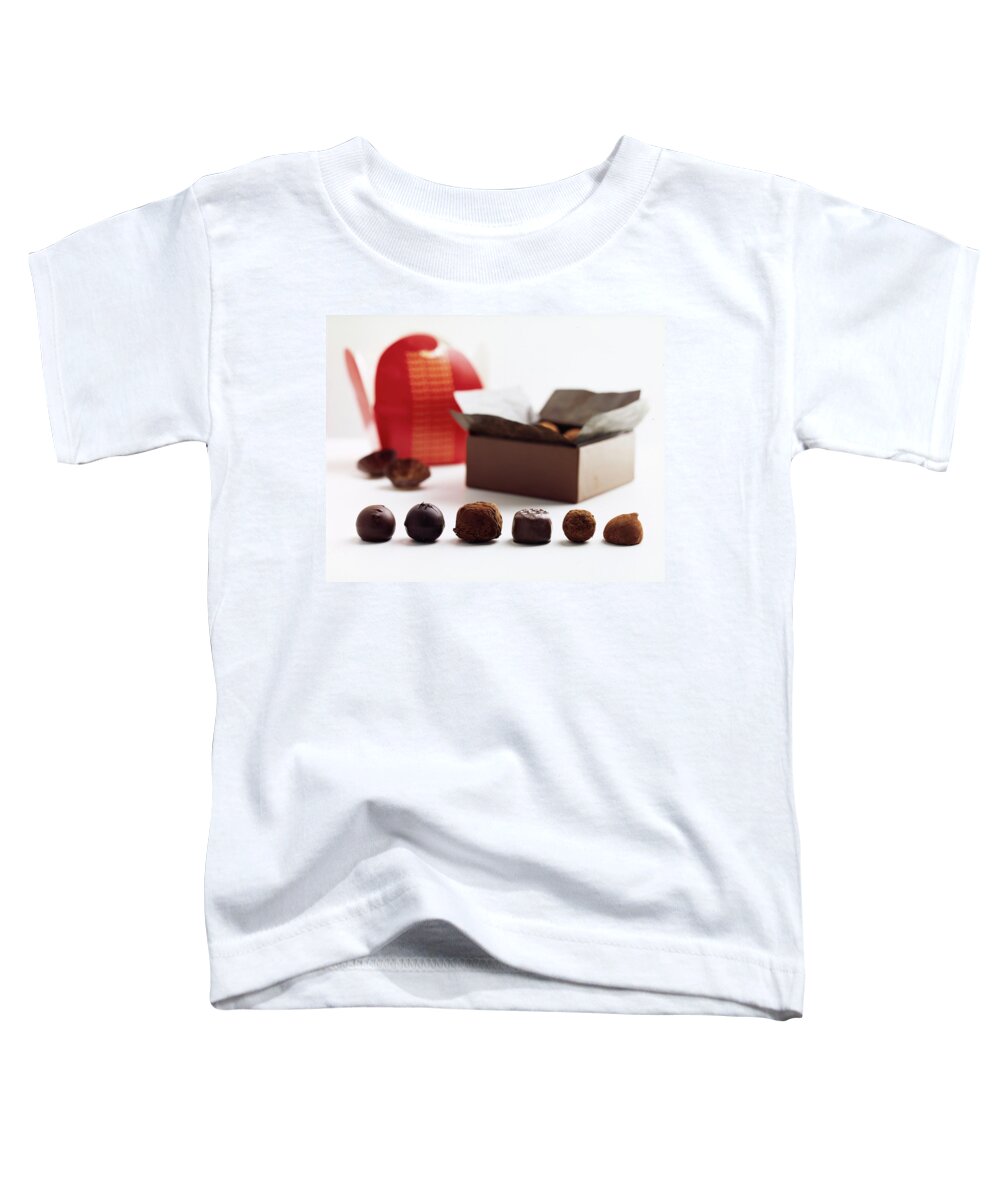 Cooking Toddler T-Shirt featuring the photograph A Still Life Photo Of Gourmet Chocolates by Romulo Yanes