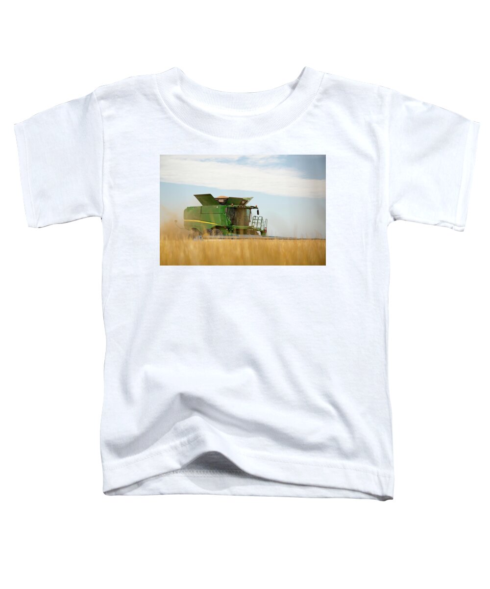 Combine Toddler T-Shirt featuring the photograph Combine Cuts Wheat In Northeast by Kevan Dee