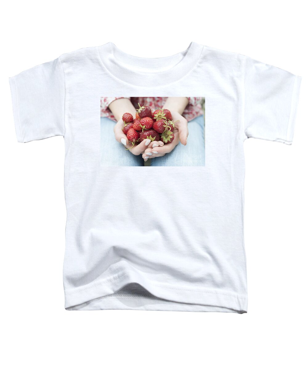Strawberries Toddler T-Shirt featuring the photograph Hands holding fresh strawberries by Elena Elisseeva