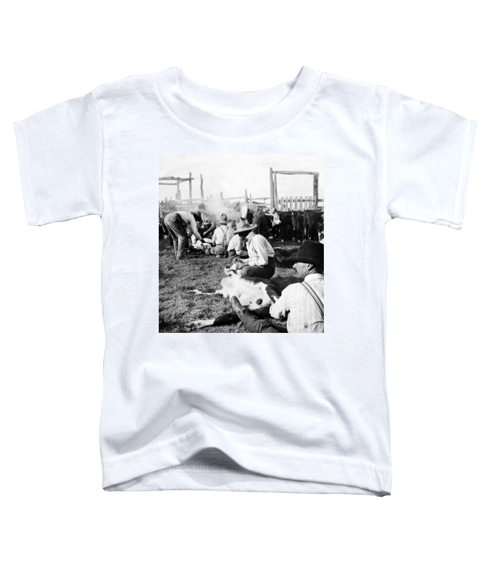 Texas Toddler T-Shirt featuring the photograph Texas Ranchers branding calves  c 1905 by International Images