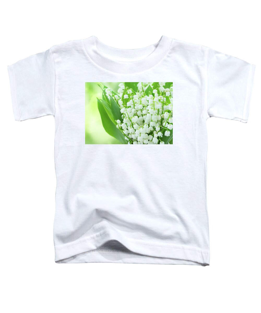 Lilly Toddler T-Shirt featuring the photograph Lilly of the Valley Flowers Close up by Anastasy Yarmolovich