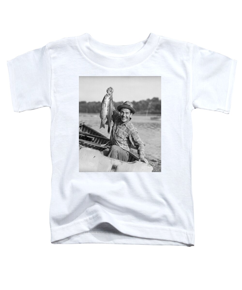 1940s Toddler T-Shirt featuring the photograph Man With Fresh Caught Fish by Debrocke/ClassicStock