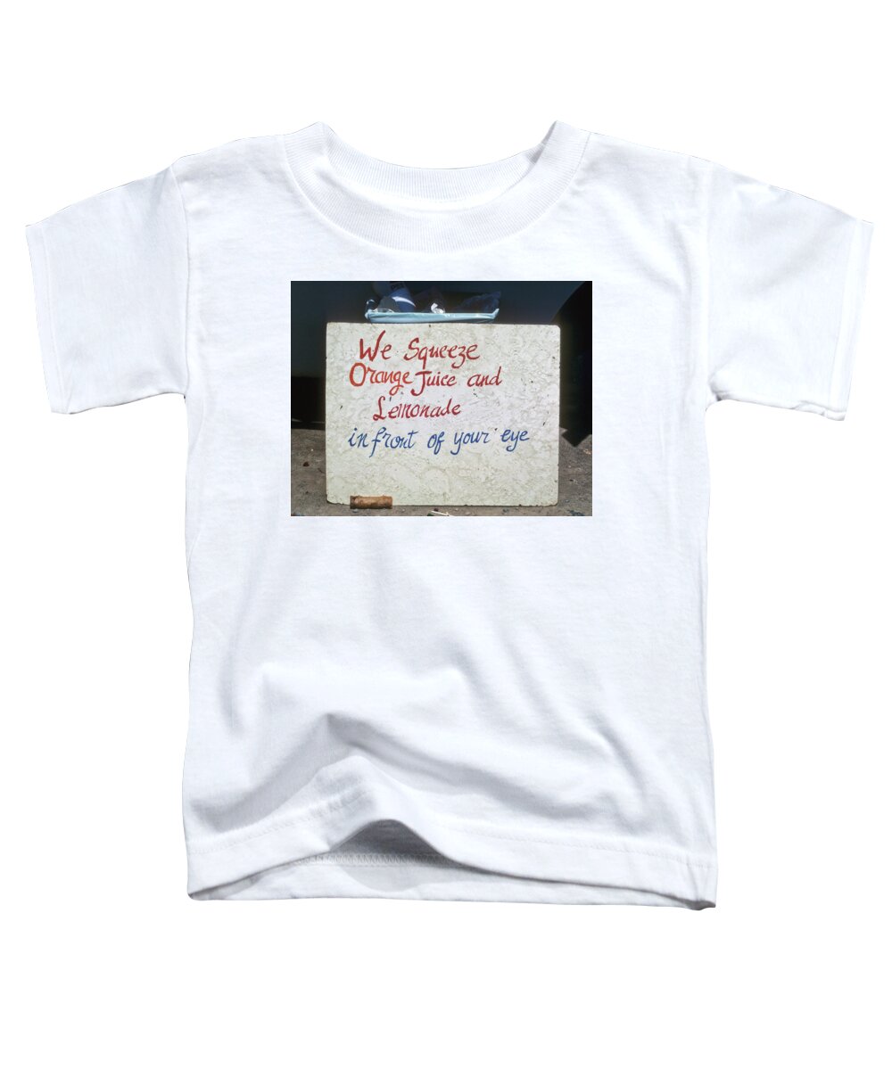 Color Toddler T-Shirt featuring the photograph Squeezed Juice sign by Frank DiMarco