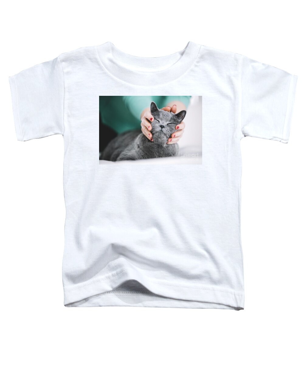 Cat Toddler T-Shirt featuring the photograph Woman holding cat's head, petting him. by Michal Bednarek
