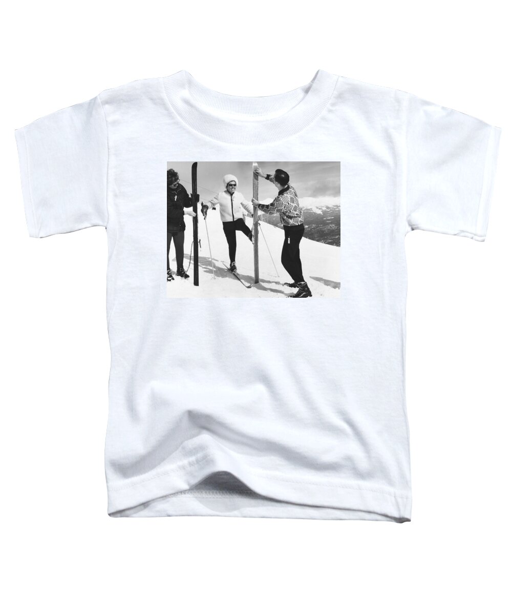 1960s Toddler T-Shirt featuring the photograph Women Waxing Skis by Underwood Archives