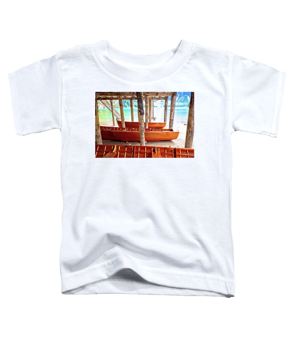 Prags Toddler T-Shirt featuring the photograph Wooden boats under boat house on Braies lake by Brch Photography