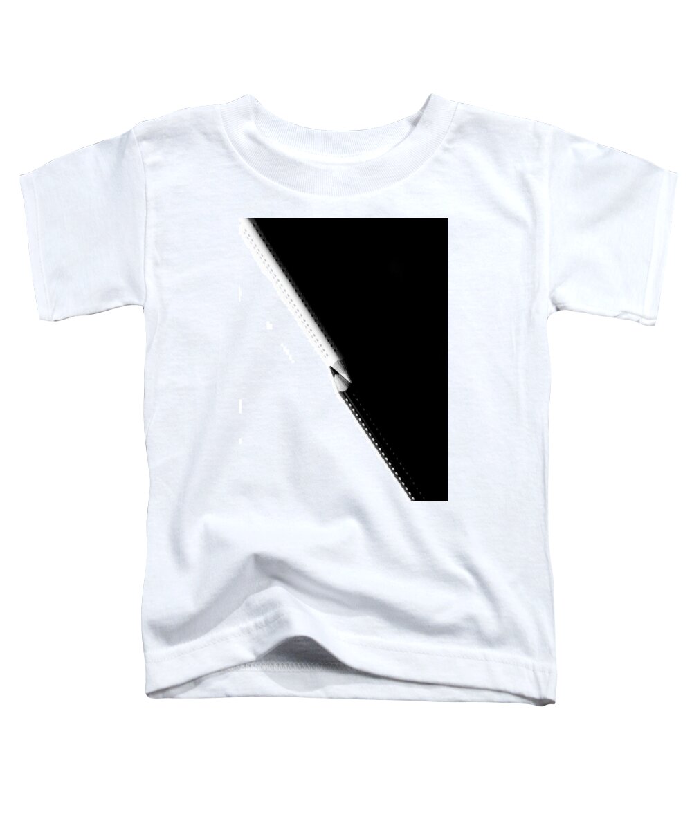 Education Toddler T-Shirt featuring the photograph Two drawing pencils on a black and white surface. by Michalakis Ppalis