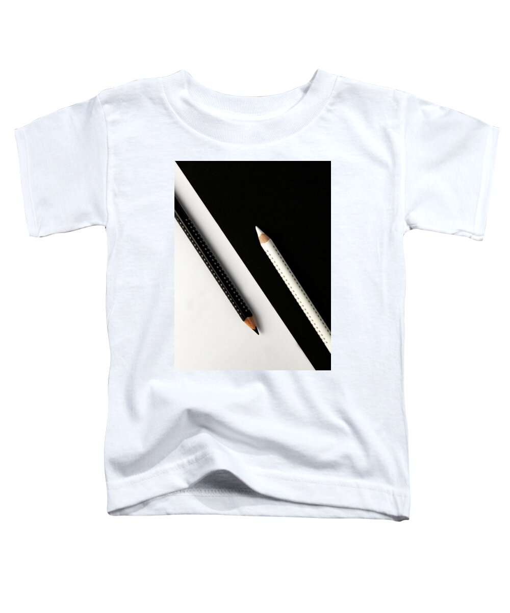 Pencil Toddler T-Shirt featuring the photograph Two drawing pencils on a black and white surface. by Michalakis Ppalis