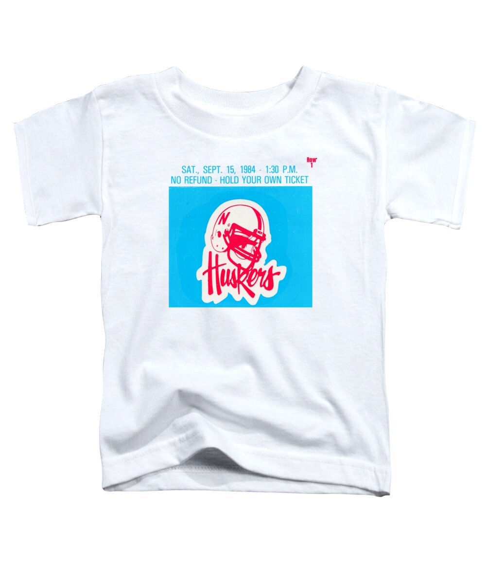 Nebraska Toddler T-Shirt featuring the mixed media 1984 Minnesota vs. Nebraska Football Ticket Art by Row One Brand