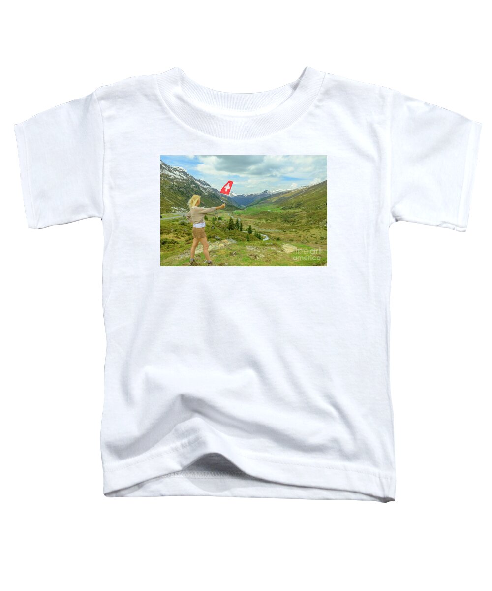 Switzerland Toddler T-Shirt featuring the photograph Tourist girl with swiss flag at Fluela Pass by Benny Marty