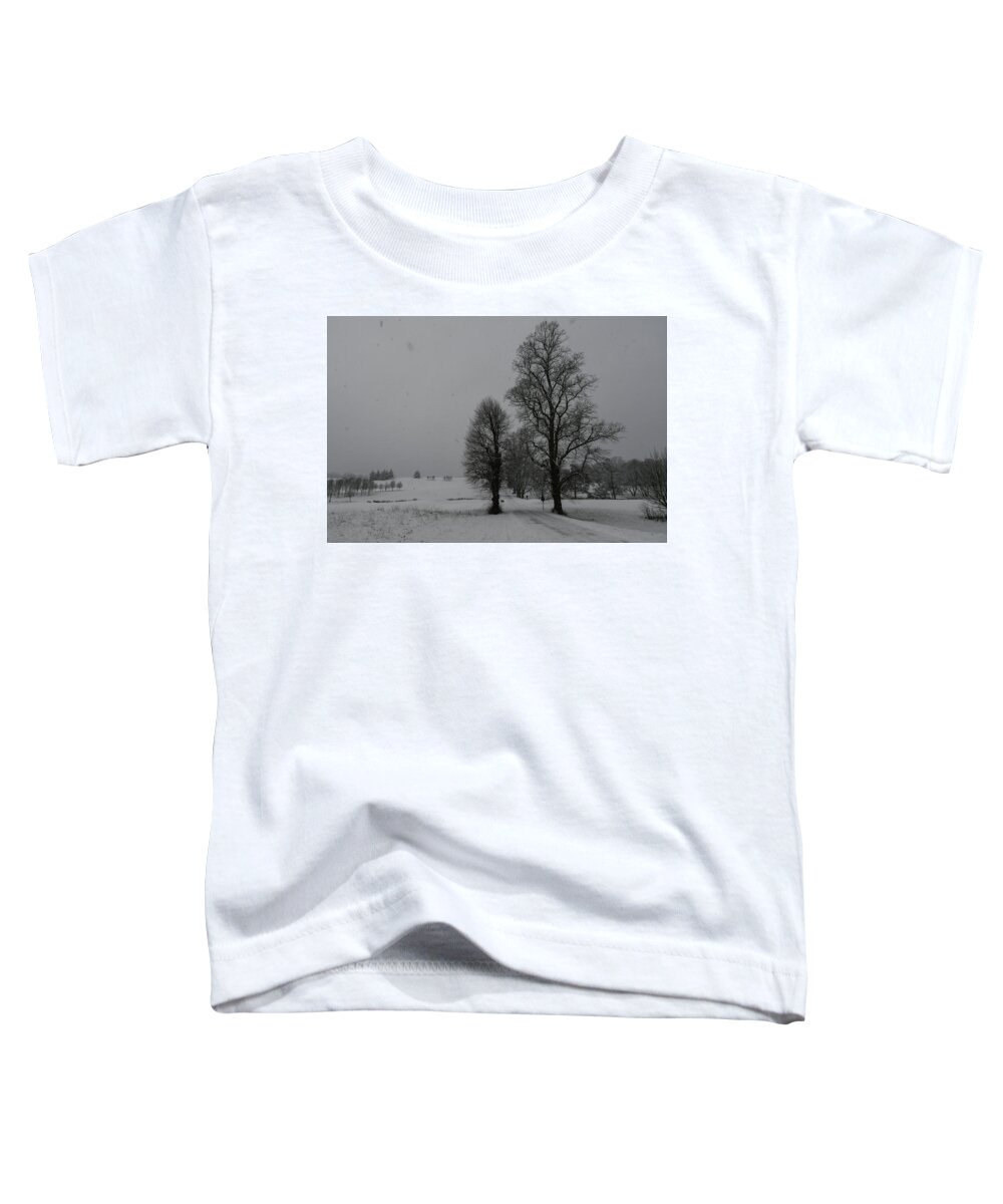 Herts Toddler T-Shirt featuring the photograph Trees in a snow storm by Andrew Lalchan