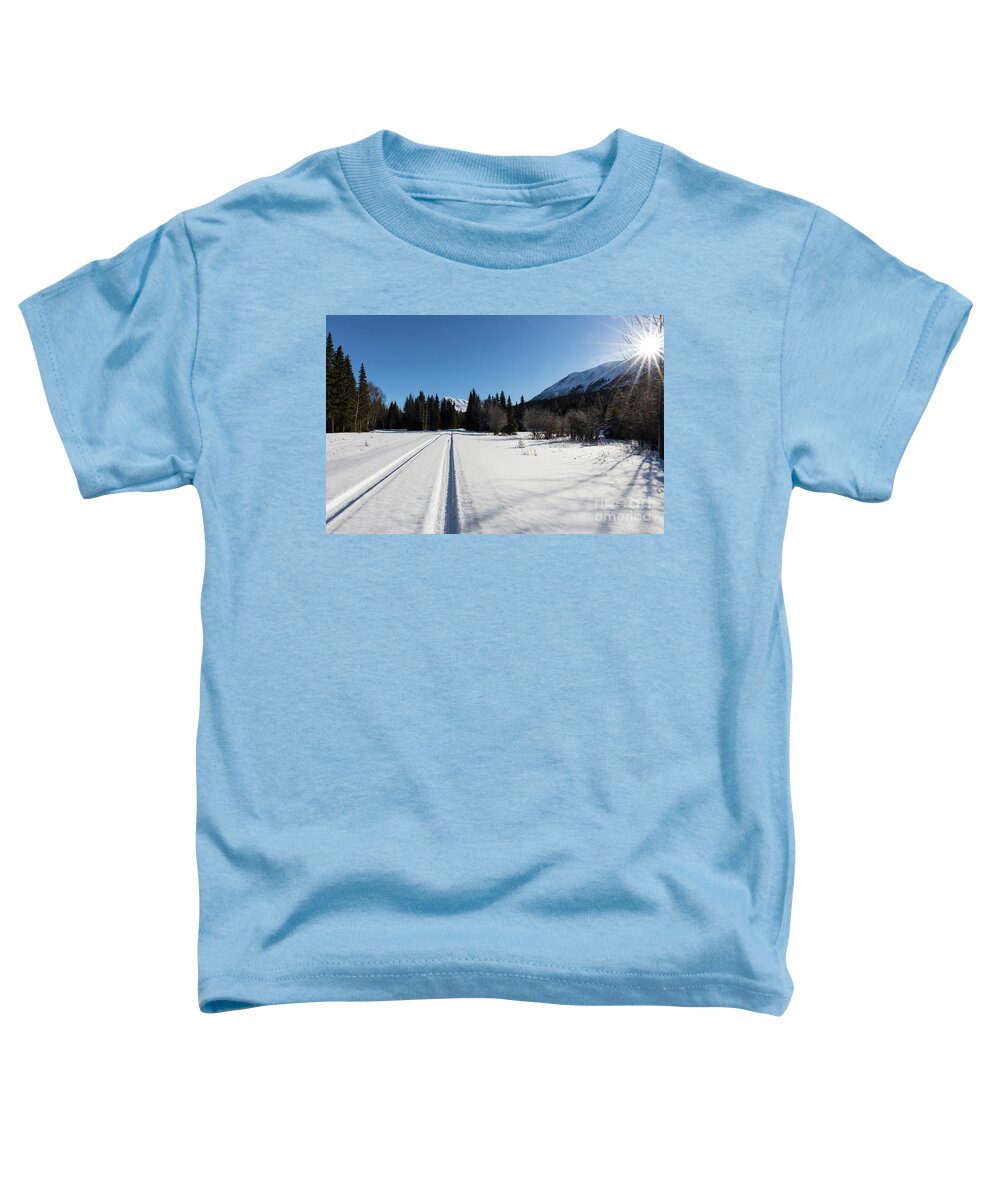 Kenai Peninsula Toddler T-Shirt featuring the photograph Tire tracks in snow in an isolated area of the Kenai Peninsula by Louise Heusinkveld