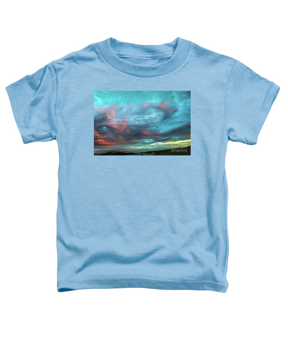 Vibrant Toddler T-Shirt featuring the digital art Driving toward the sunset with dramatic sky near Grand Canyon US by Susan Vineyard