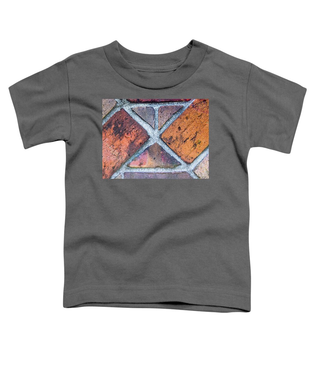 Brick Abstract Toddler T-Shirt featuring the photograph Against A Brick Wall by Carolyn Marshall