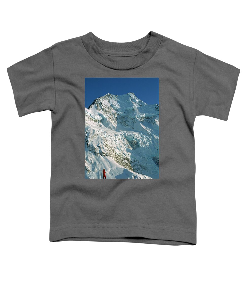 00260054 Toddler T-Shirt featuring the photograph Climber Enjoying View Of Mt Cook by Colin Monteath