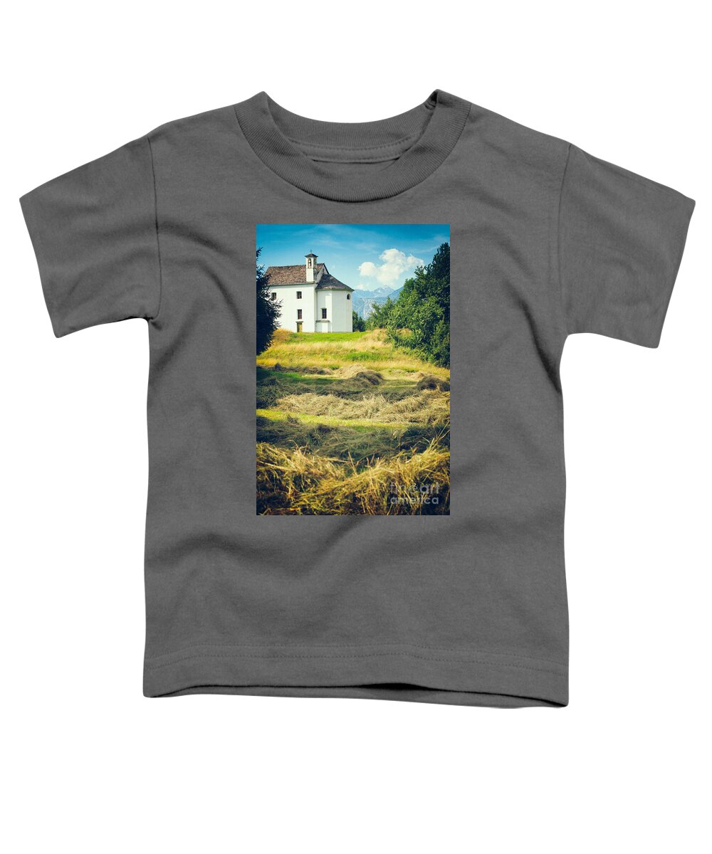 Alpine Toddler T-Shirt featuring the photograph Country church with hay by Silvia Ganora