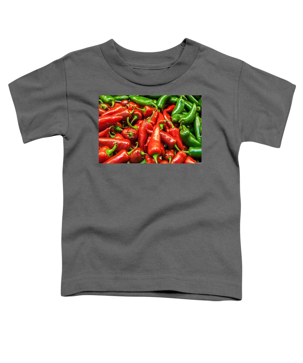 Bunch Toddler T-Shirt featuring the photograph Delicious fresh green and red chili fruit on display at supermar by Alex Grichenko
