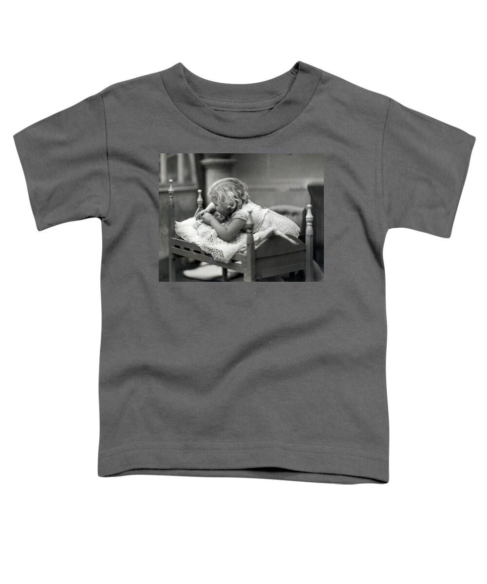 1 Person Toddler T-Shirt featuring the photograph Girl Puts Doll To Bed by Underwood Archives