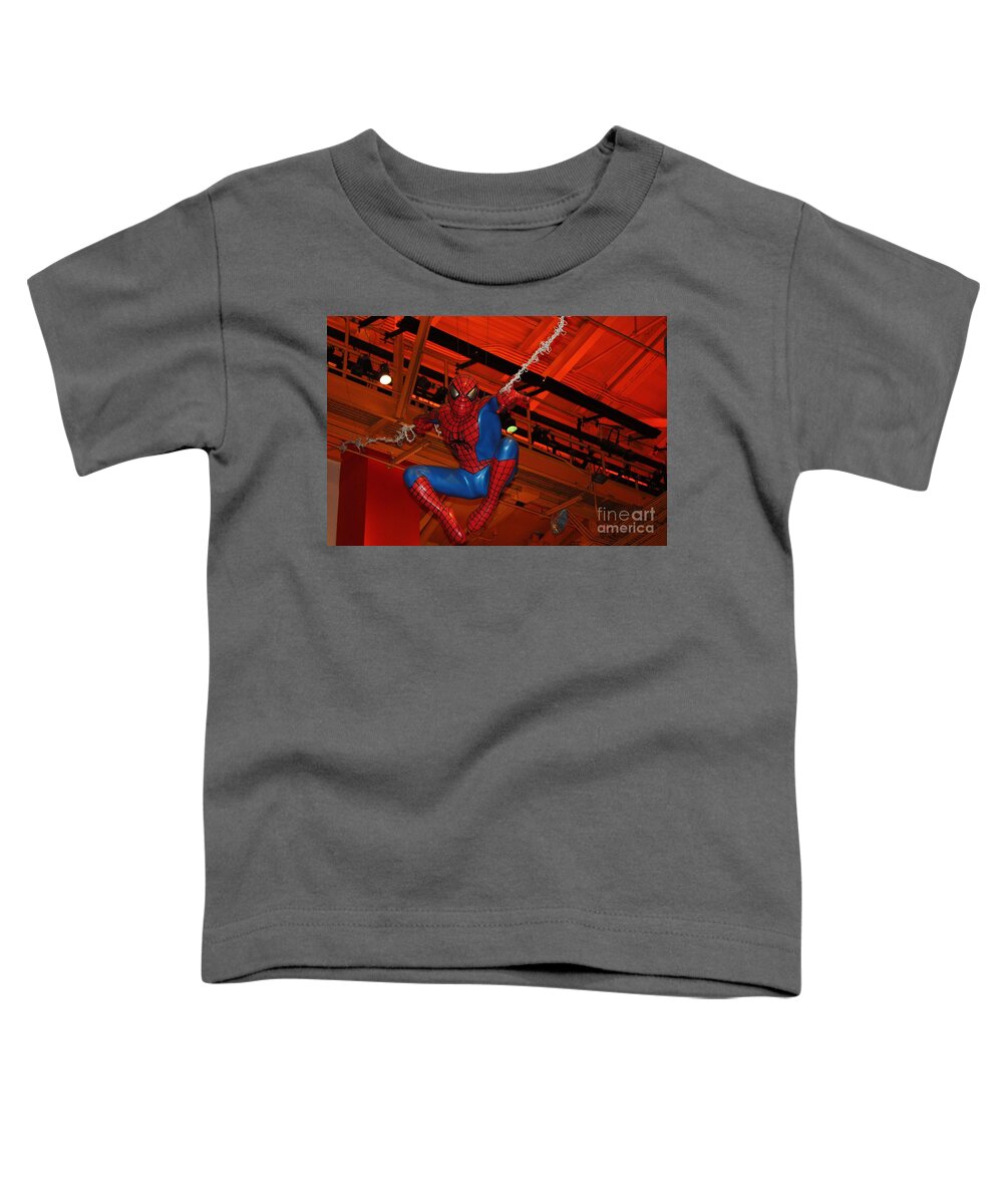Spiderman Swinging Through The Air Toddler T-Shirt featuring the photograph Spiderman Swinging Through the Air by John Telfer