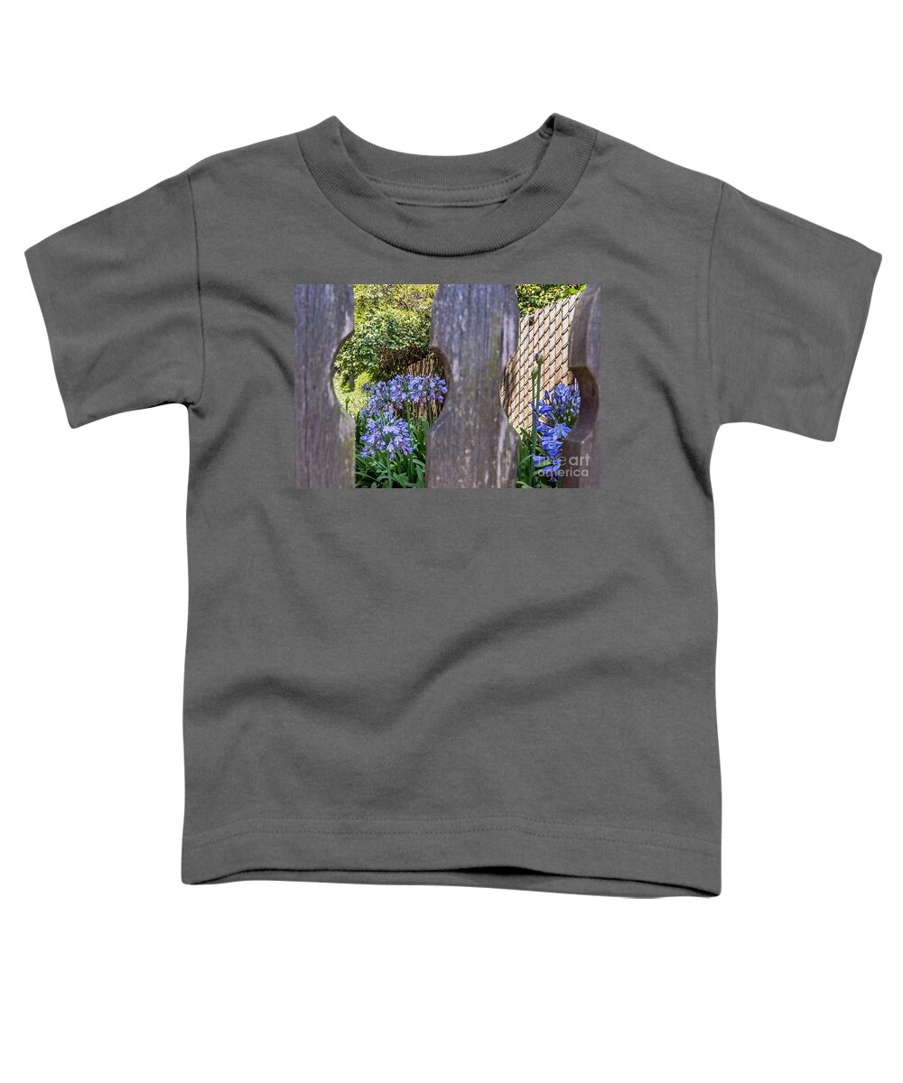 Agapanthus Toddler T-Shirt featuring the photograph Through the Fence by Kate Brown