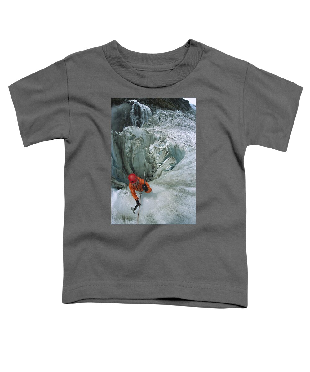 Hhh Toddler T-Shirt featuring the photograph Ice Climber On Steep Ice In Fox Glacier by Colin Monteath