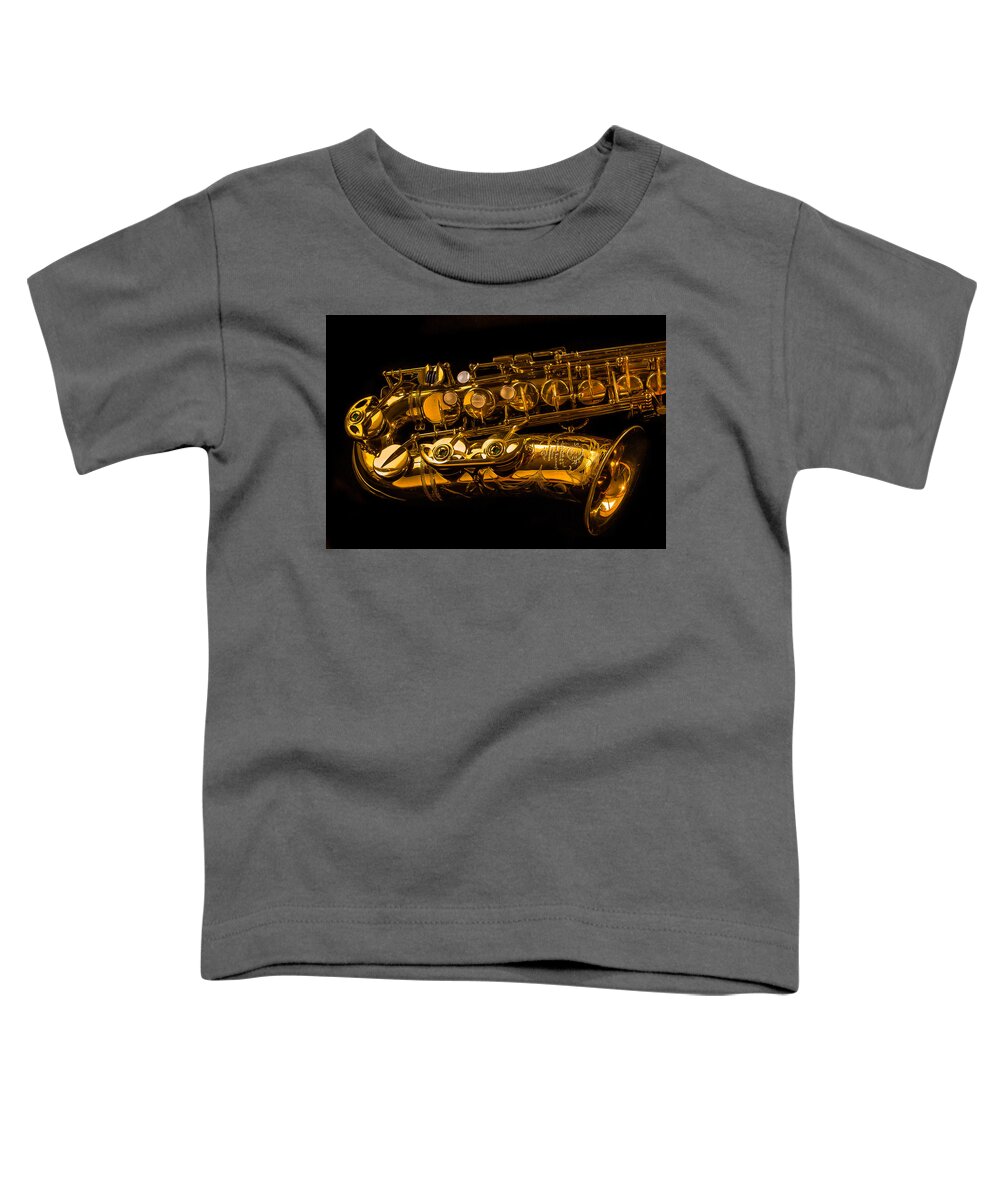The Lying Sax Toddler T-Shirt featuring the photograph The Lying Sax by Jean Noren