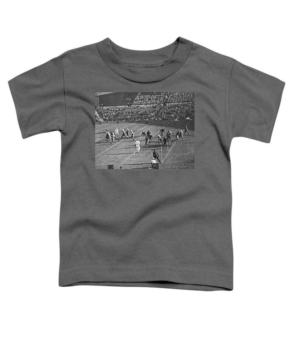 1910s Toddler T-Shirt featuring the photograph Quarterback Throwing Football #1 by Underwood Archives