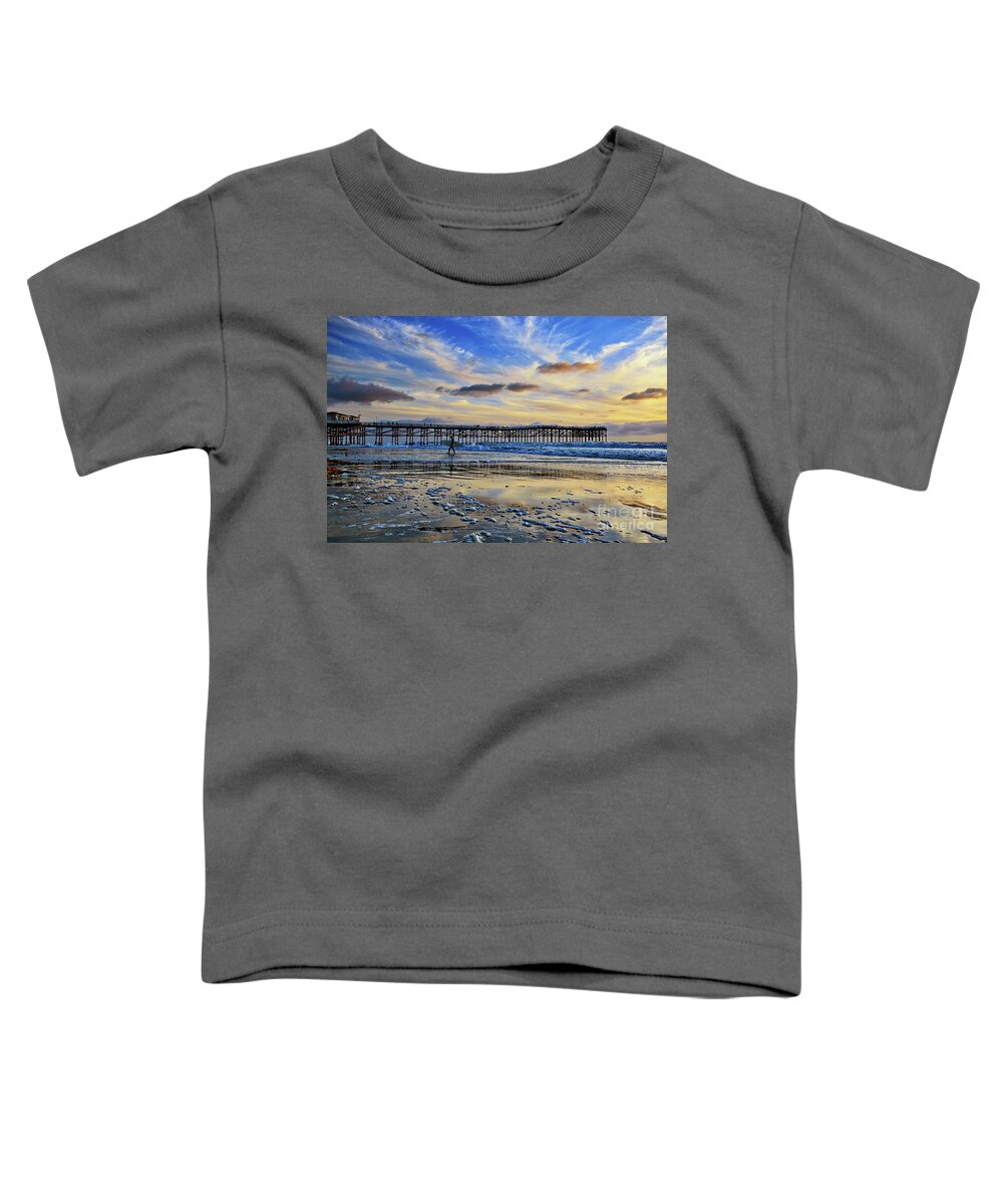Pacific Beach Toddler T-Shirt featuring the photograph A surfer heads home under a cloudy sunset at Crystal Pier by Sam Antonio