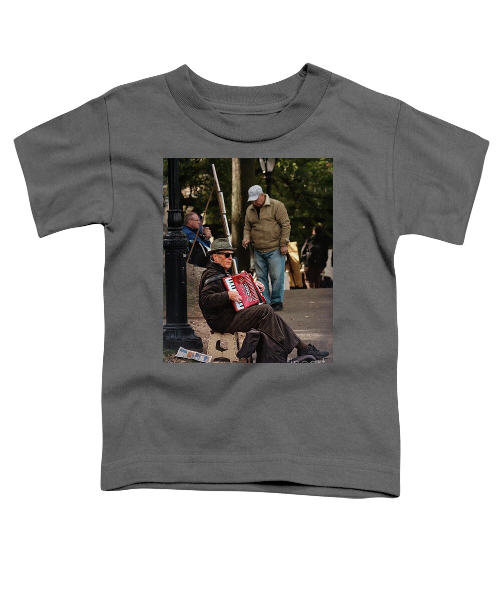 Central Park Toddler T-Shirt featuring the photograph Central Park musician by Izet Kapetanovic