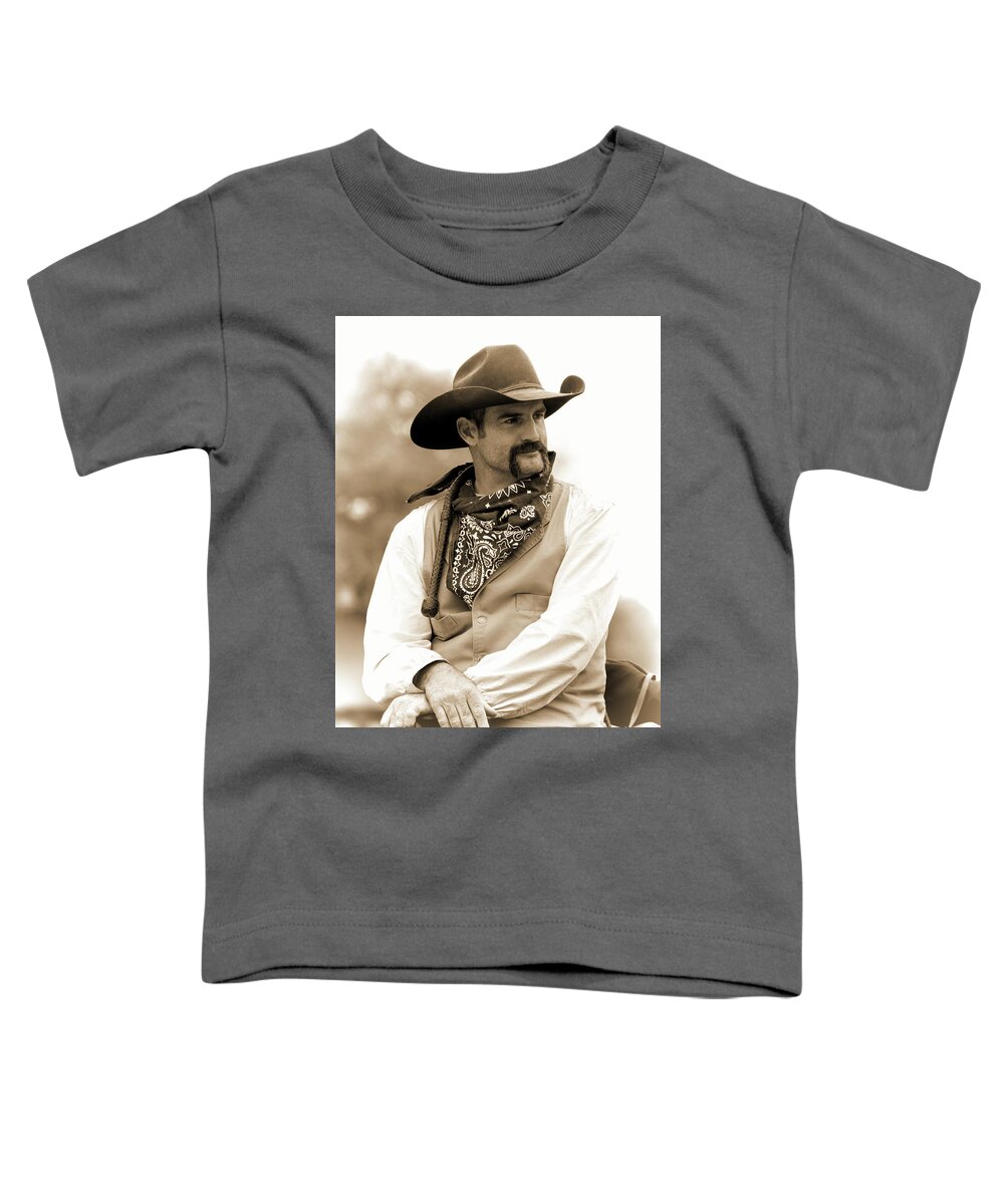 Cowboy Toddler T-Shirt featuring the photograph Content in the Saddle by Jeanne May