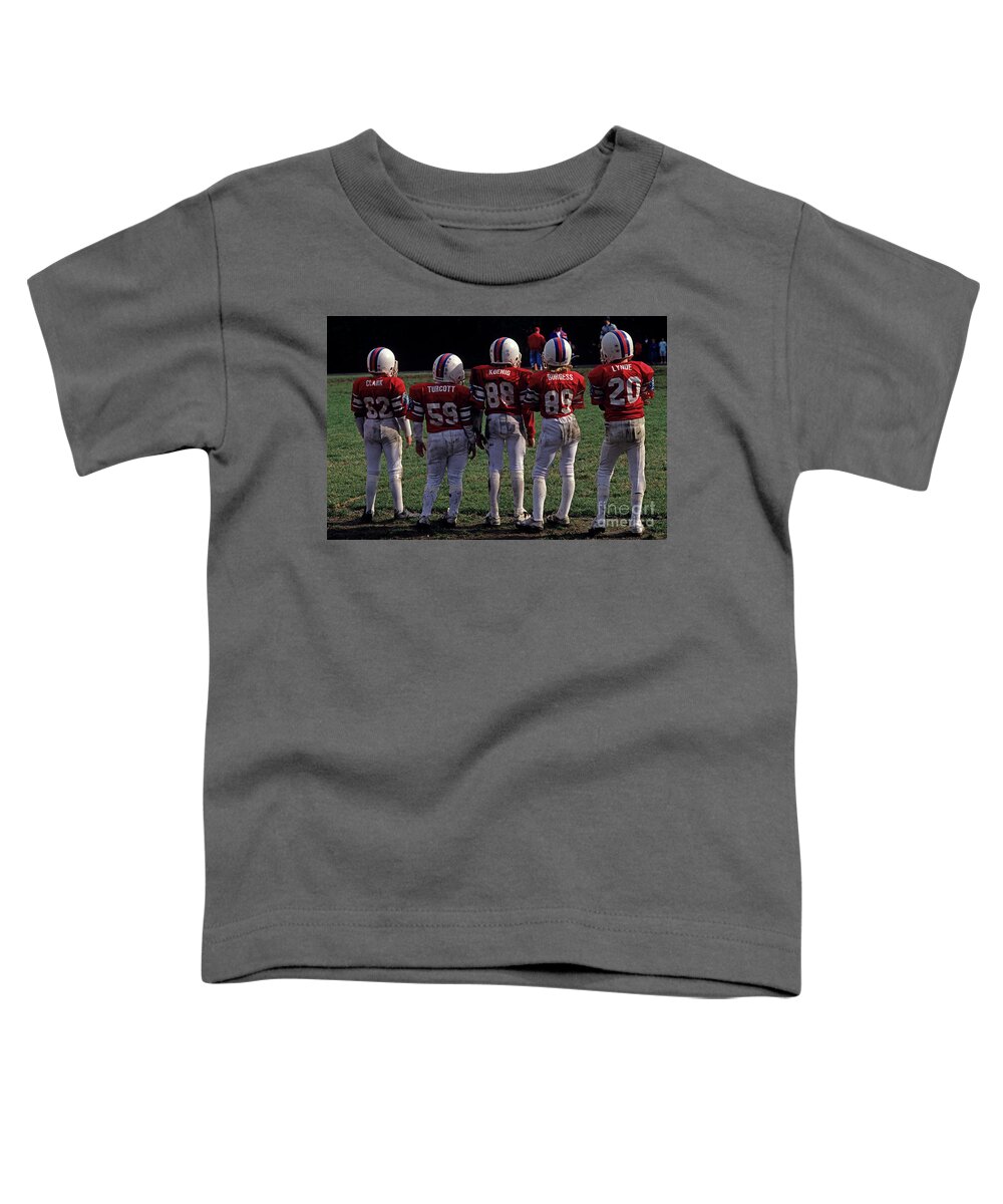 American Dream Toddler T-Shirt featuring the photograph Football Team Kids On Sideline by Jim Corwin