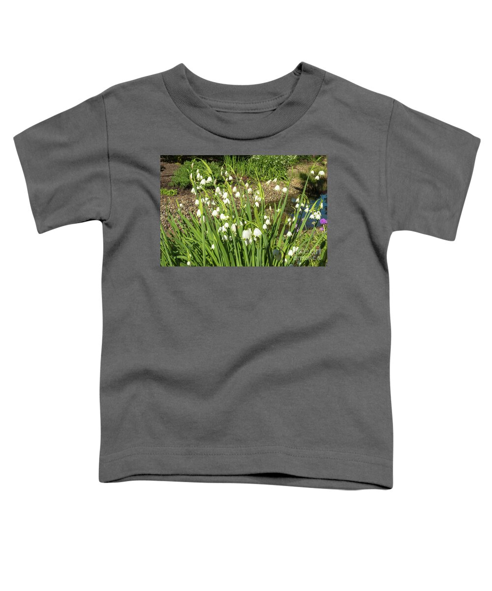 Giant Lilies Of The Valley By Marina Usmanskaya Toddler T-Shirt featuring the photograph Giant lilies of the valley by Marina Usmanskaya