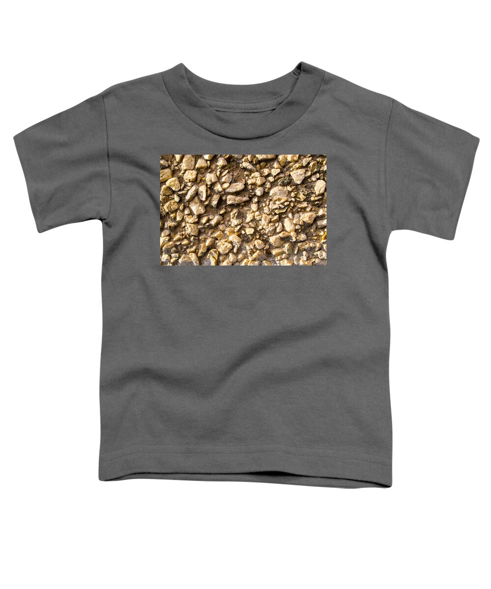 Stone Gravel Toddler T-Shirt featuring the photograph Gravel stones on a wall by John Williams