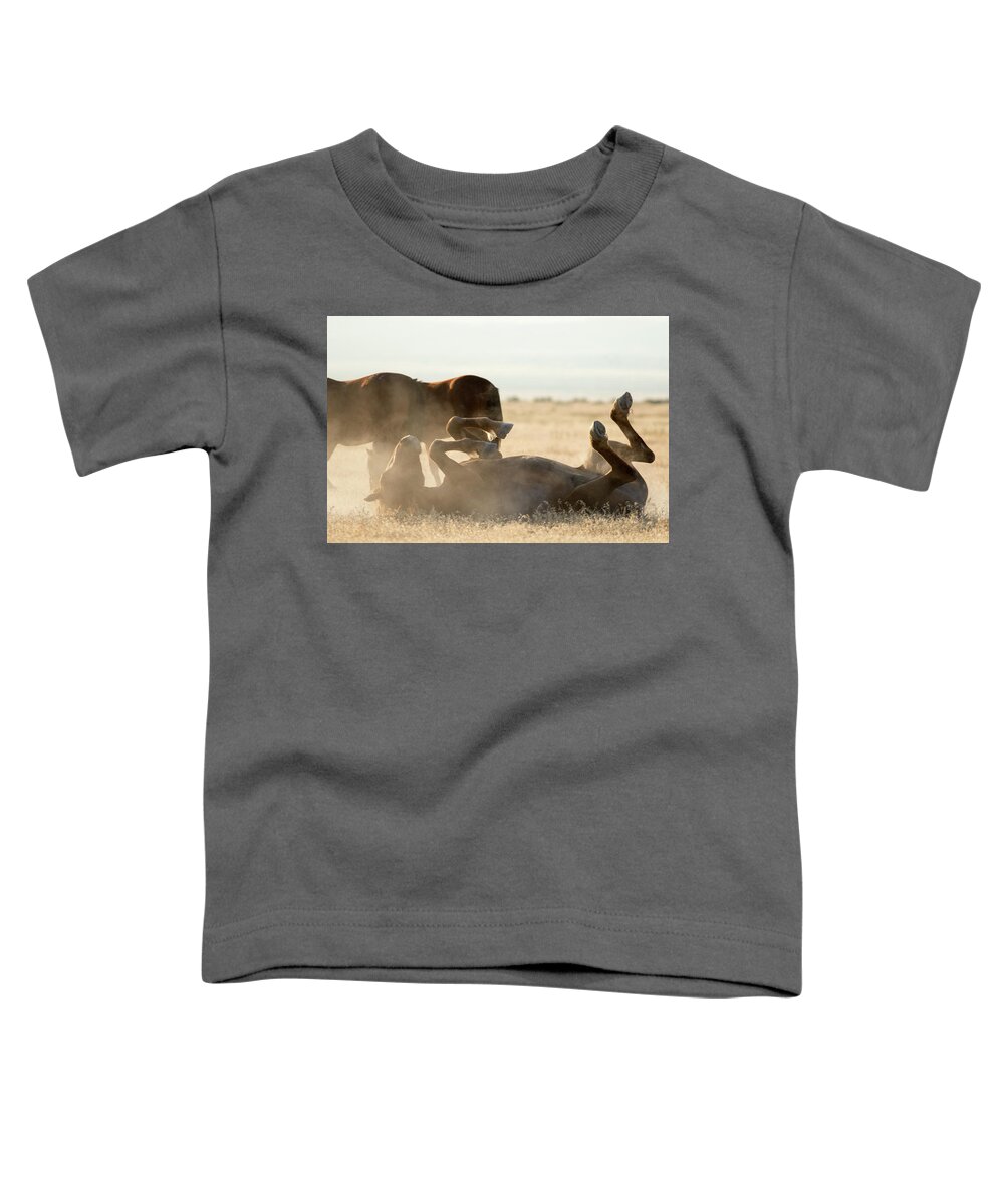 Wild Horse Toddler T-Shirt featuring the photograph Horse Playing in Dirt by Wesley Aston
