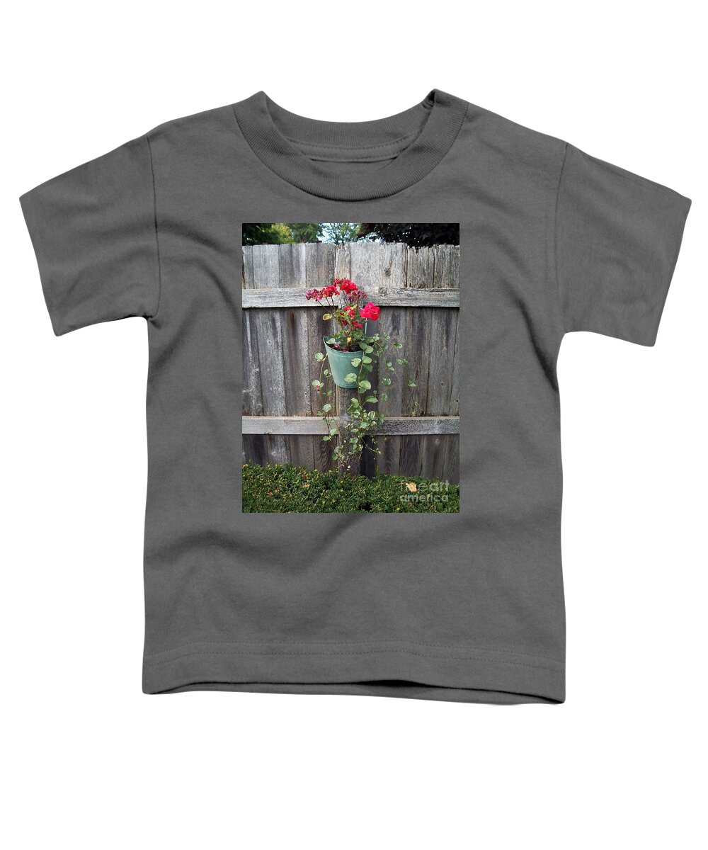 Flowers Toddler T-Shirt featuring the photograph Potted Geranium On Fence by Walter Neal