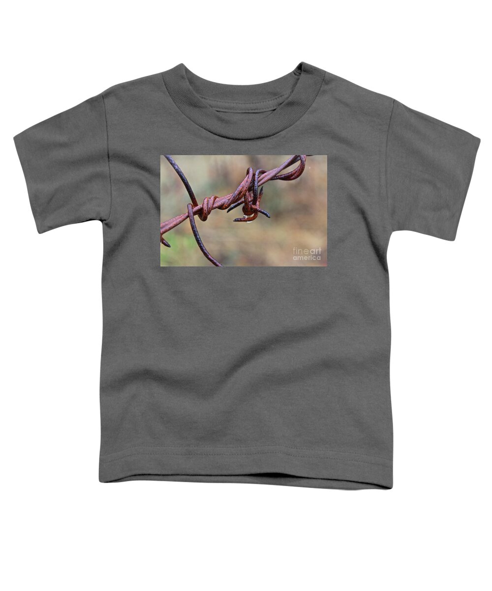 Barbed Wire Toddler T-Shirt featuring the photograph Rusted and Wet by Ann E Robson