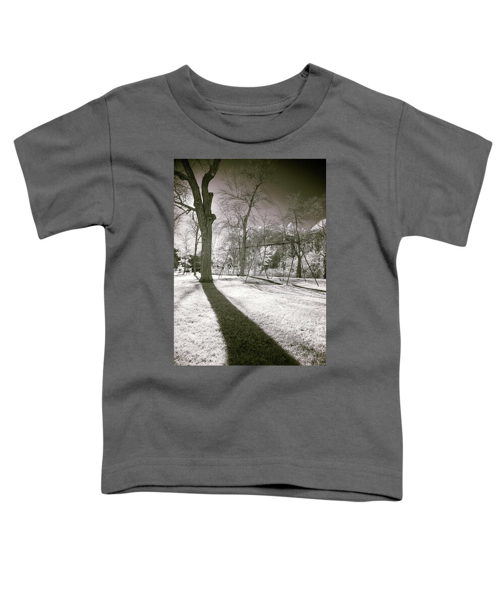 Shadow Shadows Swingset Swings Swing Set Play Ground Playground Park Public Outside Outdoors Nature Ir Infrared Infra Red Nanometer Brian Hale Brianhalephoto Hudson Ma Mass Massachusetts Sun Sky Trees Tree Toddler T-Shirt featuring the photograph Shadow of a Memory by Brian Hale