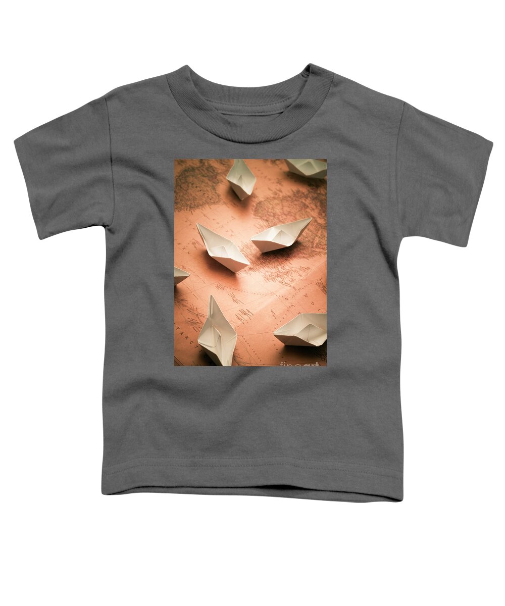 Cruise Toddler T-Shirt featuring the photograph Small paper boats on top of old map by Jorgo Photography