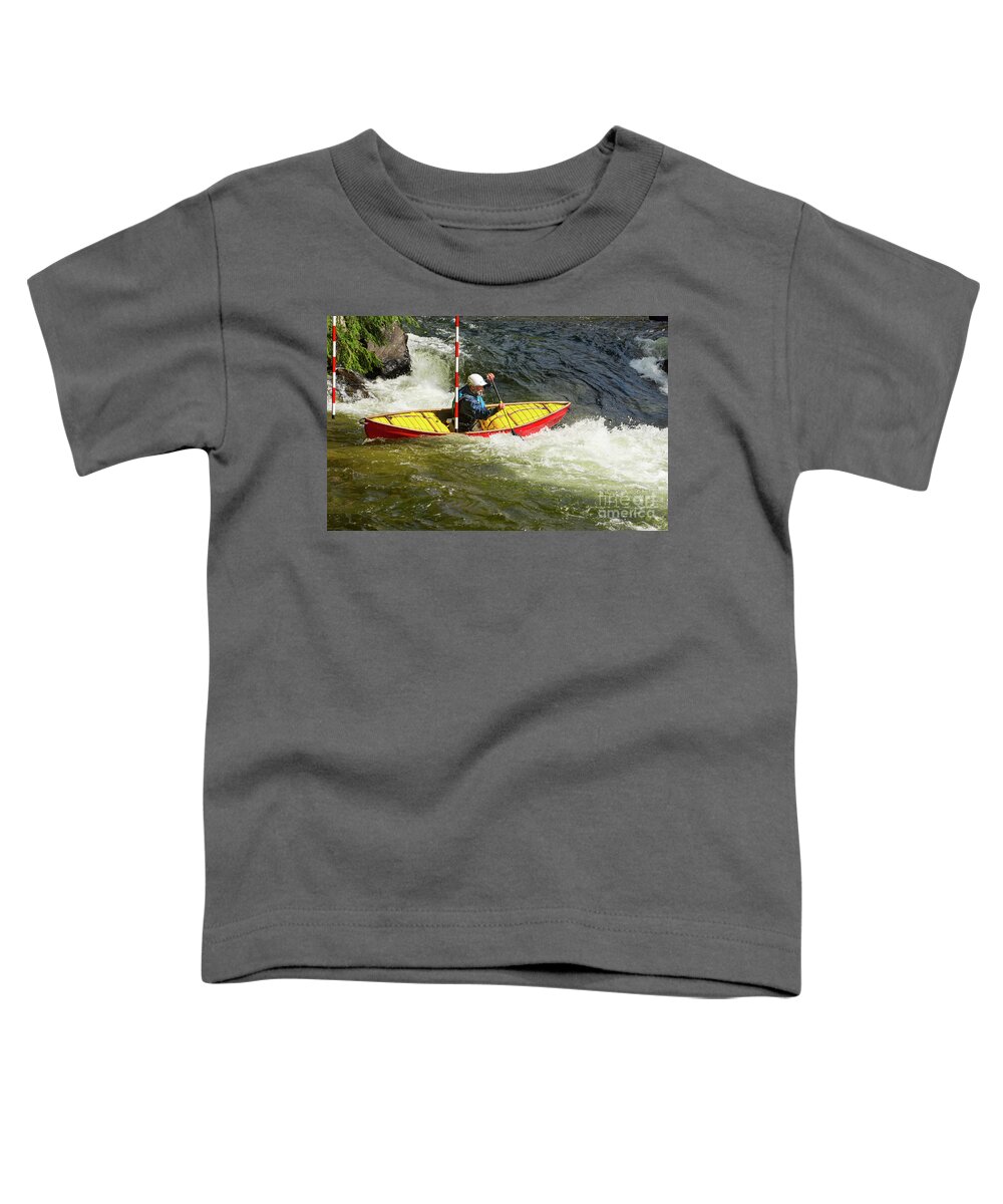 Canoe Toddler T-Shirt featuring the photograph Solo whitewater canoe clearing a slalom gate by Les Palenik