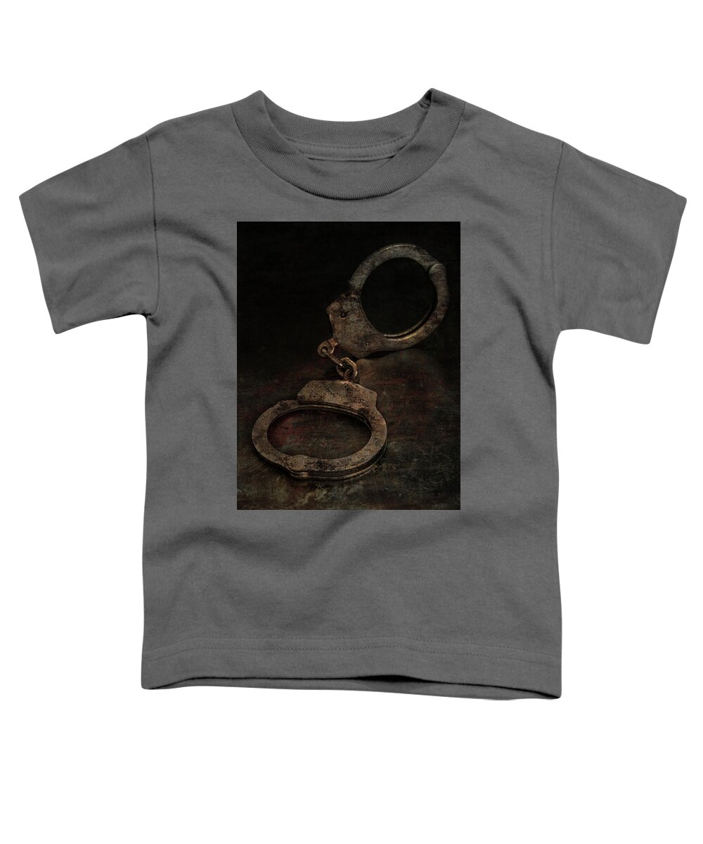Still Life Toddler T-Shirt featuring the photograph Still life with old rusty handcuffs by Jaroslaw Blaminsky