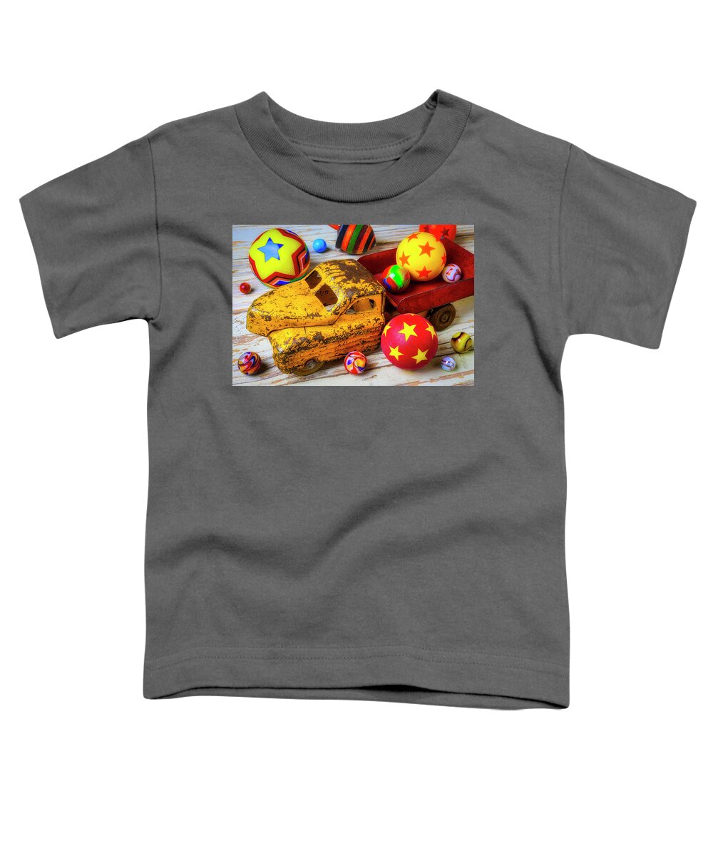 Red Toddler T-Shirt featuring the photograph Toy Truck With Balls And Marbles by Garry Gay